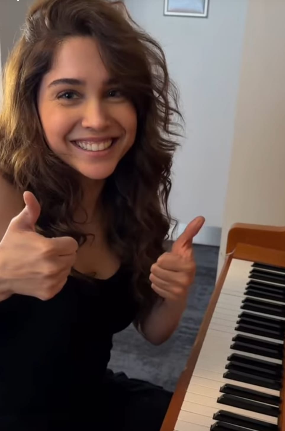 Sharvari playing Maskara on piano in all-black outfit Sharvari playing Maskara on piano in all-black outfit