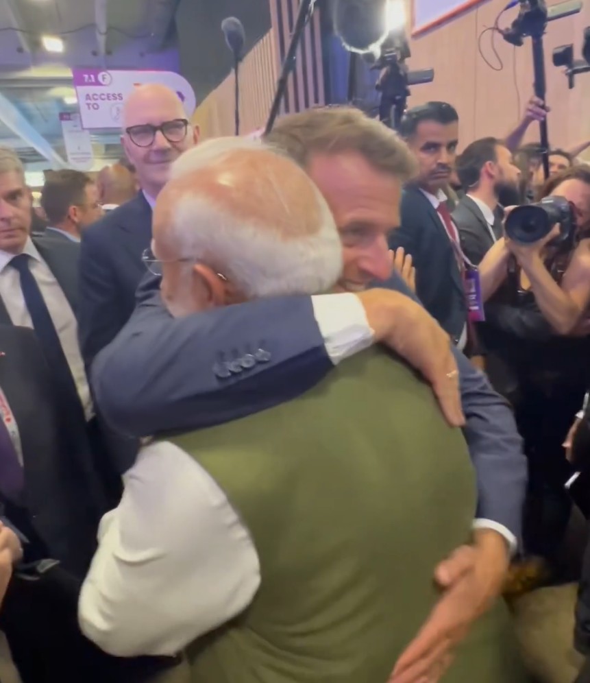 French President Macron bidding farewell to PM Modi with a hug in Paris French President Macron bidding farewell to PM Modi with a hug in Paris