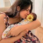 Divyanka Tripathi cradling twin babies with sunflower emoji covering faces Divyanka Tripathi cradling twin babies with sunflower emoji covering faces