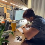 Harshvardhan Rane studying for exam with notes and laptop Harshvardhan Rane studying for exam with notes and laptop