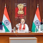 HM Amit Shah launching FCRA 2.0 portal and e-OCI Card at event with officials HM Amit Shah launching FCRA 2.0 portal and e-OCI Card at event with officials