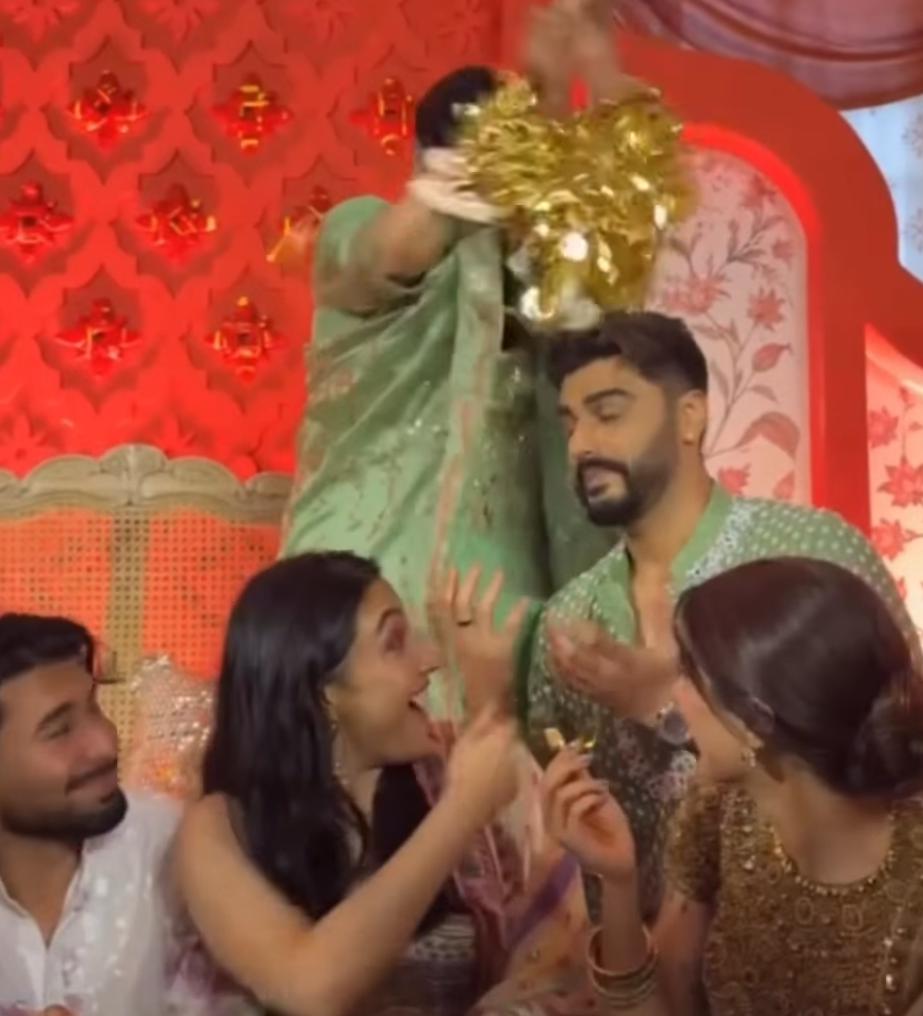 Arjun Kapoor holding a wedding kaleera with a broad smile during Anshula Kapoor's ceremony Arjun Kapoor holding a wedding kaleera with a broad smile during Anshula Kapoor's ceremony