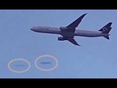 2 long Cigar Shaped UFOs flying at extreme speed by Plane over london, UK - YouTube