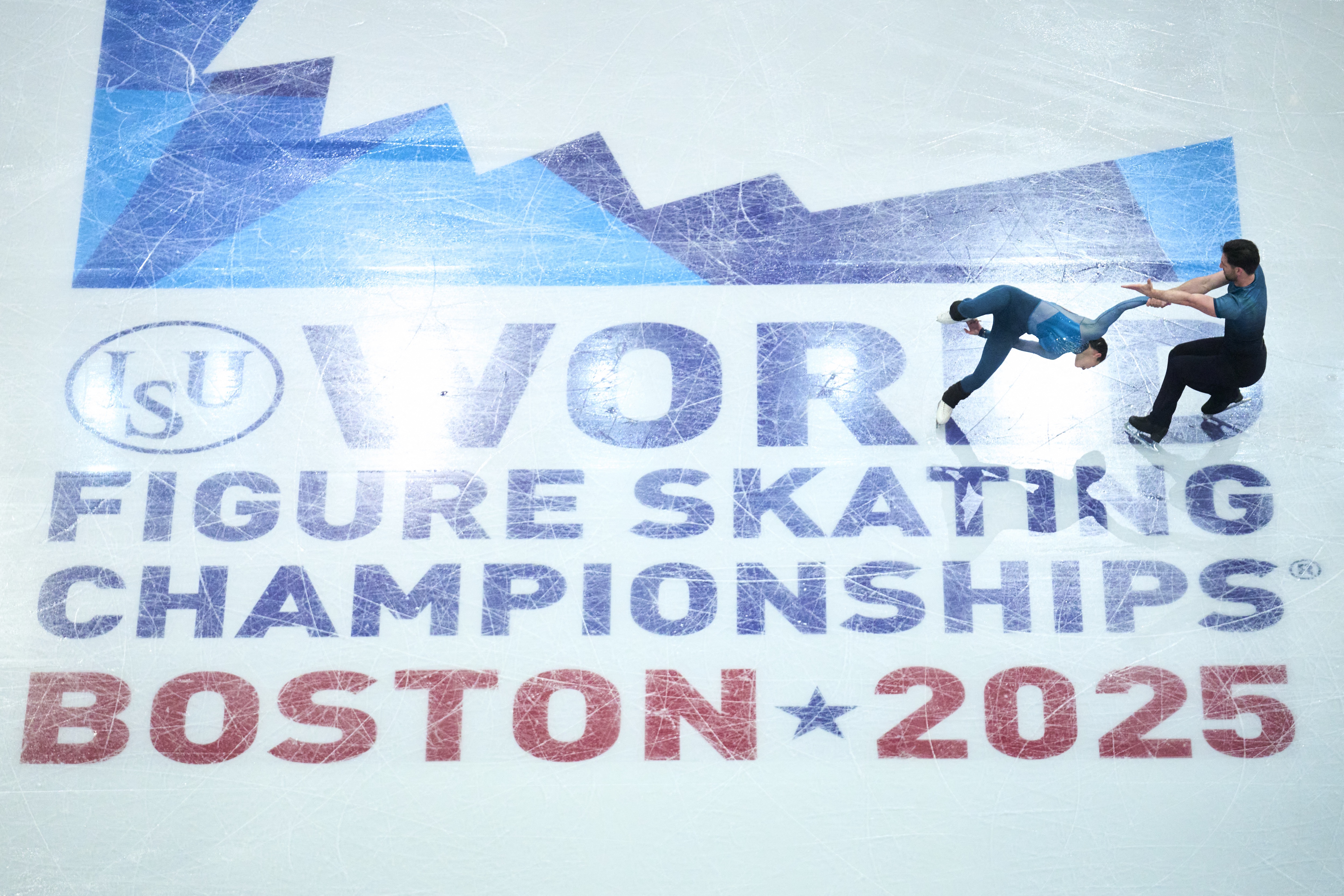 Canadian pairs skaters Deanna Stellato-Dudek and Maxime Deschamps during practice on Tuesday. (Geoff Robins/AFP via Getty Images)