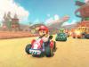 Los videojuegos a precios de $70 o $80 son una «ganga», según un exejecutivo de PlayStation Escena colorida del videojuego Mario Kart con Mario conduciendo un kart rojo en primer plano, seguido por Luigi, Toad y Bowser en una carrera por un circuito ambientado en un paisaje desértico con estructuras y banderas al fondo.