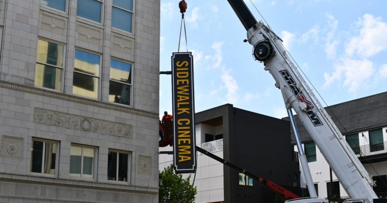 Sidewalk Cinema installs new sign ahead of 28th annual film festival Sidewalk Cinema installs new sign ahead of 28th annual film festival