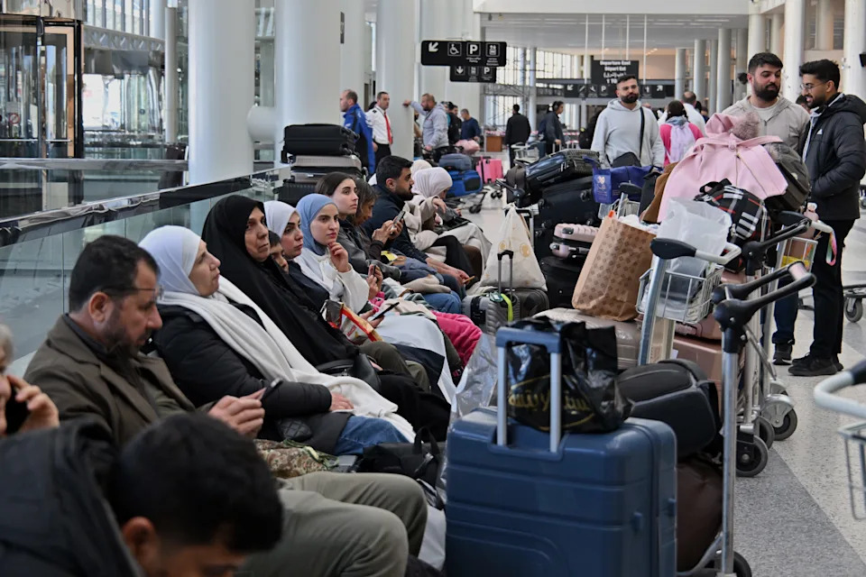 Photographs present chaos at airports as passengers are left stranded as a result of canceled flights Photographs present chaos at airports as passengers are left stranded as a result of canceled flights