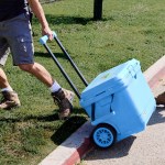 Coleman® Pro Series 55-Quart Wheeled Hard Cooler - 26357 blue sky angled image Coleman® Pro Series 55-Quart Wheeled Hard Cooler - 26357 blue sky angled image