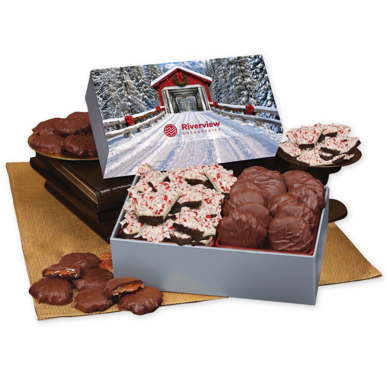 Peppermint Bark & Pecan Clusters in Gift Box with Snow-covered Bridge Sleeve 1 Peppermint Bark & Pecan Clusters in Gift Box with Snow-covered Bridge Sleeve 1