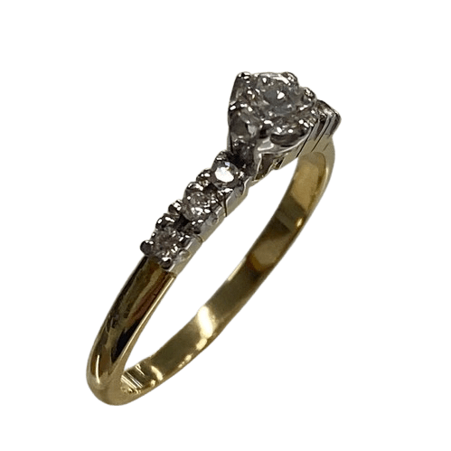 Ladies 18ct Yellow & White Gold Diamond Ring. Single Round 0.20ct Brilliant Cut White Gold Claw Set Diamond, With 6 Round Brilliant Cut White Gold Claw Set Diamonds. TDW 0.29ct. Size L&1/2 . With Valuation Certificate.