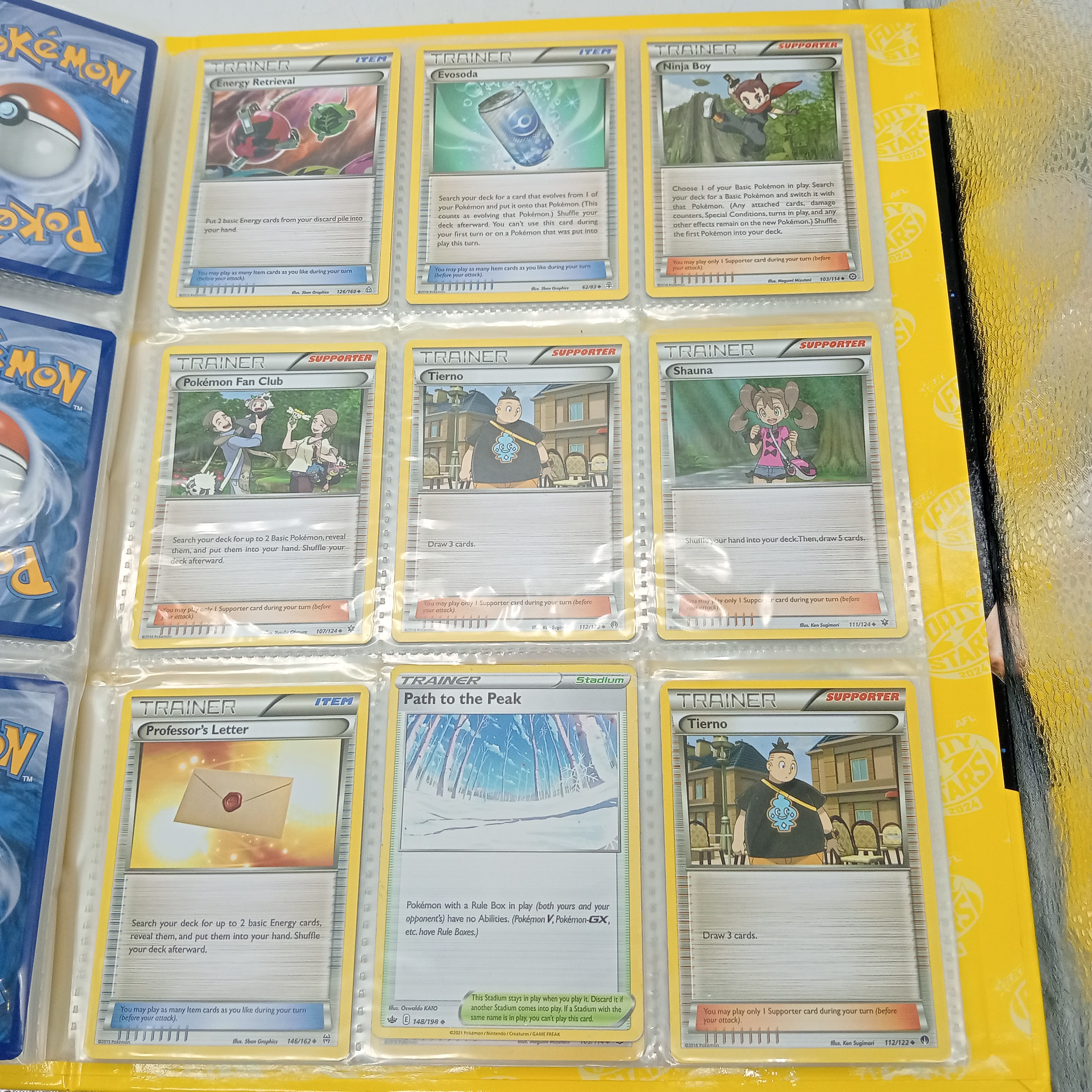 Estimated 170 Assorted Pokemon Cards In AFL Album Includes: Holo, Reverse Holo, Common, Trainer Cards (WR 1343495)