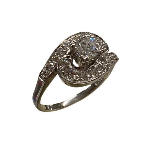Ladies 14ct White Gold 19 Diamond Ring. Round Brilliant Cut 4 Claw Set 0.35ct Diamond. With 18 Round Brilliant Cut Diamonds Grain Set Stones Set in Cross Over Shoulders. TDW 0.78ct. Size L/6 . With Valuation Certificate – (NG 145637)