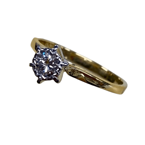 Ladies 18ct Yellow & White Gold Single Stone Diamond Ring. Round Brilliant Cut Diamond Illusion Grain Set With Tapered Gallery With Pointed Swept Up Shoulders. TDW 0.20ct. Size L/6, With Valuation Certificate (NG 142944)