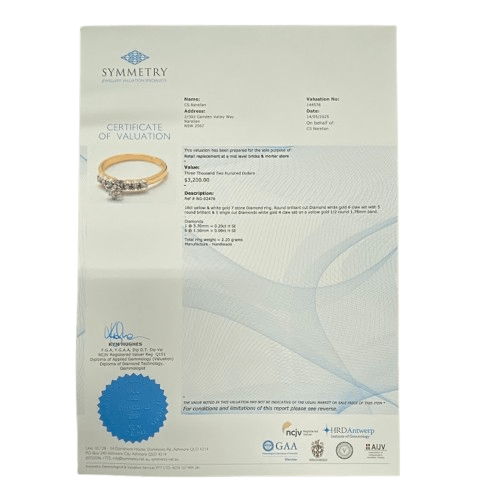 Ladies 18ct Yellow & White Gold Diamond Ring. Single Round 0.20ct Brilliant Cut White Gold Claw Set Diamond, With 6 Round Brilliant Cut White Gold Claw Set Diamonds. TDW 0.29ct. Size L&1/2 . With Valuation Certificate.