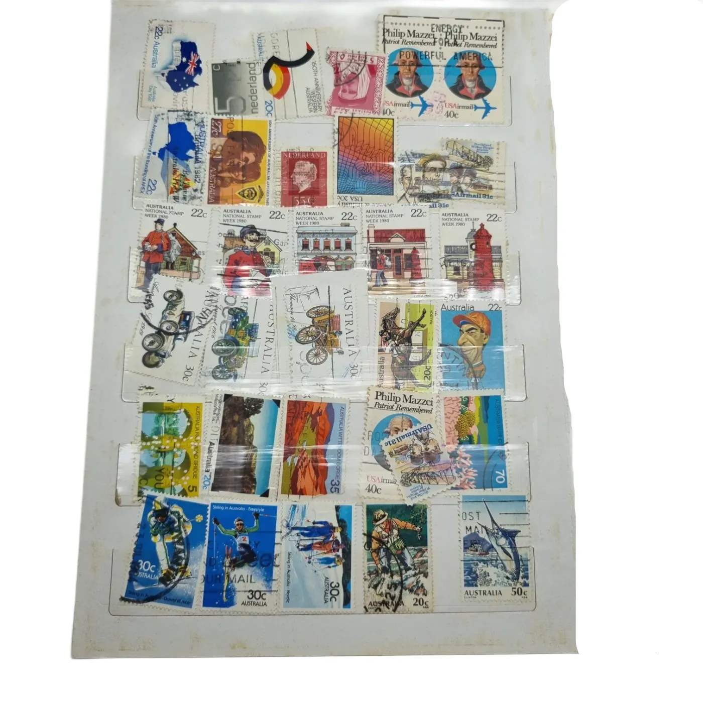 Assorted Global Stamps In Blue Stamp Book (Including: Indonesia, Australia, USA, Nederland)