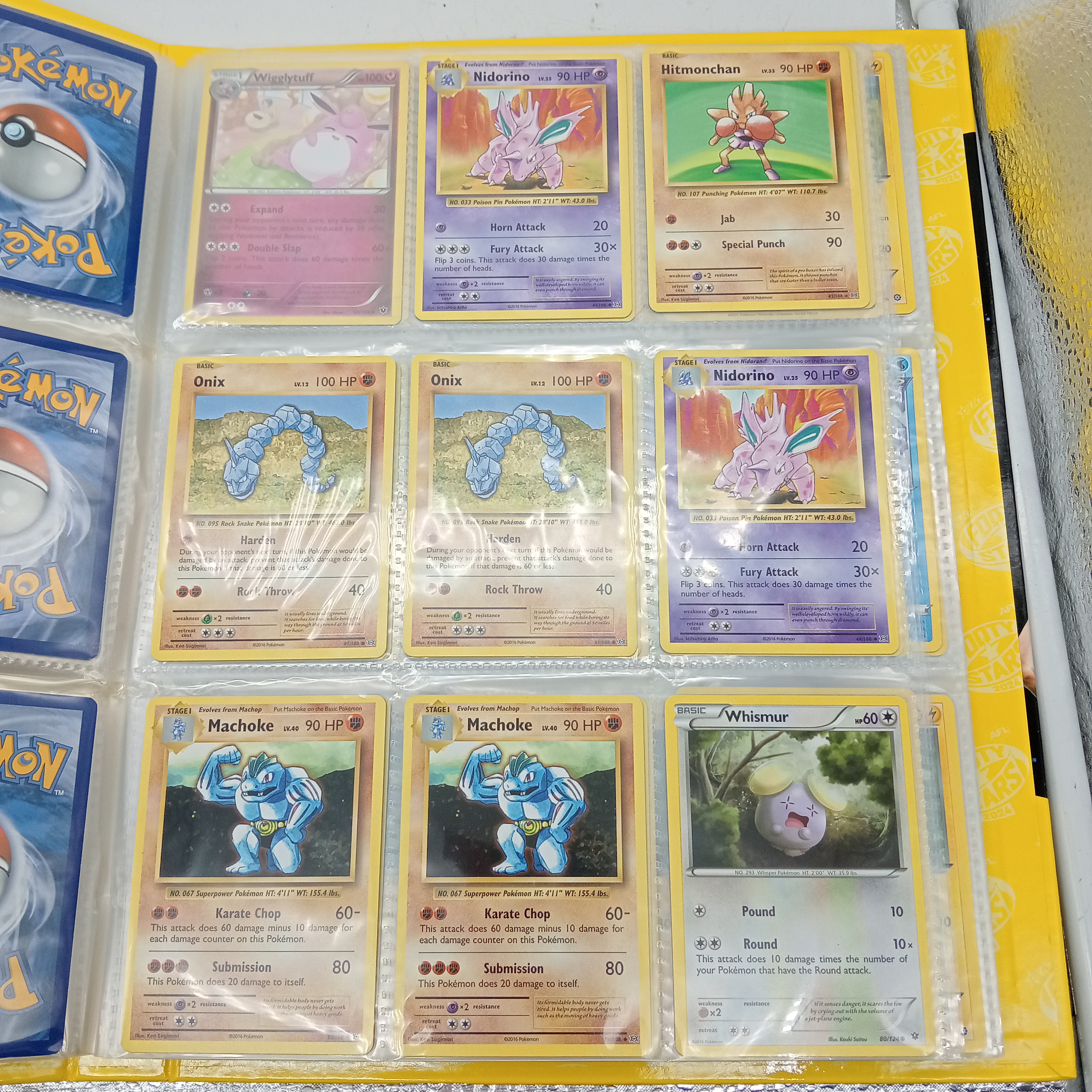 Estimated 170 Assorted Pokemon Cards In AFL Album Includes: Holo, Reverse Holo, Common, Trainer Cards (WR 1343495)