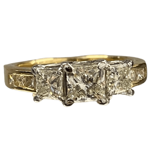 Ladies 18ct Yellow Gold, 3 Princess Cut Claw Set Diamonds with 6 Princess Cut Chanel Set Diamonds. Size M. TDW 1.50ct. With Valuation Certificate