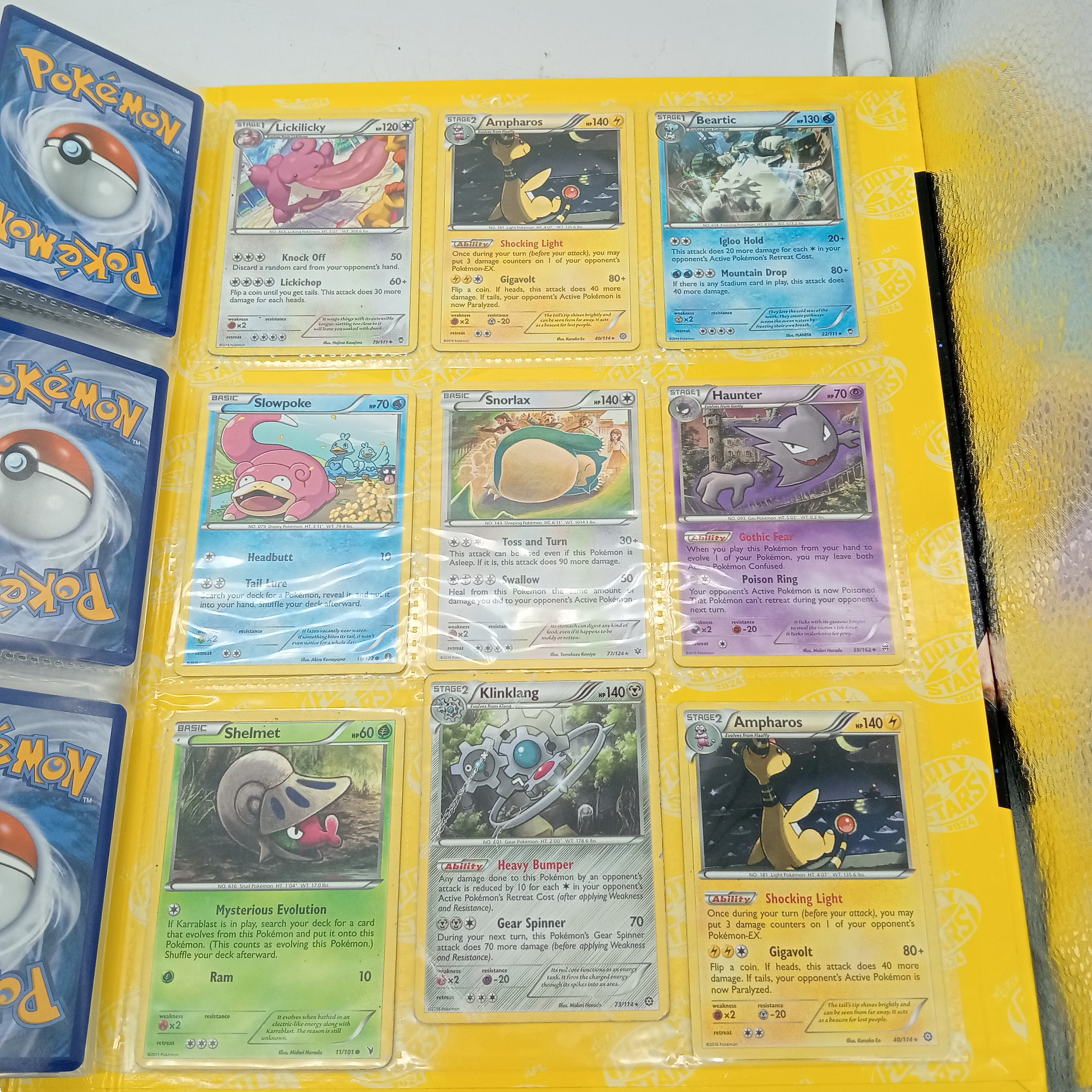 Estimated 170 Assorted Pokemon Cards In AFL Album Includes: Holo, Reverse Holo, Common, Trainer Cards (WR 1343495)
