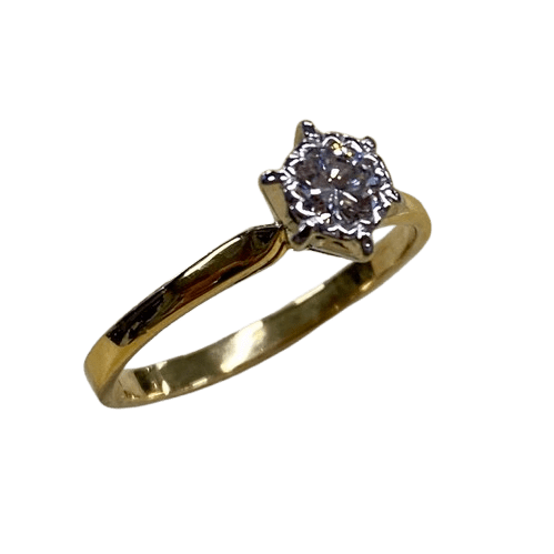 Ladies 18ct Yellow & White Gold Single Stone Diamond Ring. Round Brilliant Cut Diamond Illusion Grain Set With Tapered Gallery With Pointed Swept Up Shoulders. TDW 0.20ct. Size L/6, With Valuation Certificate (NG 142944)