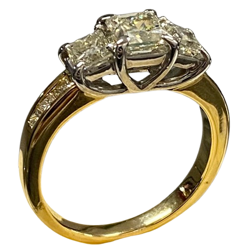 Ladies 18ct Yellow Gold, 3 Princess Cut Claw Set Diamonds with 6 Princess Cut Chanel Set Diamonds. Size M. TDW 1.50ct. With Valuation Certificate