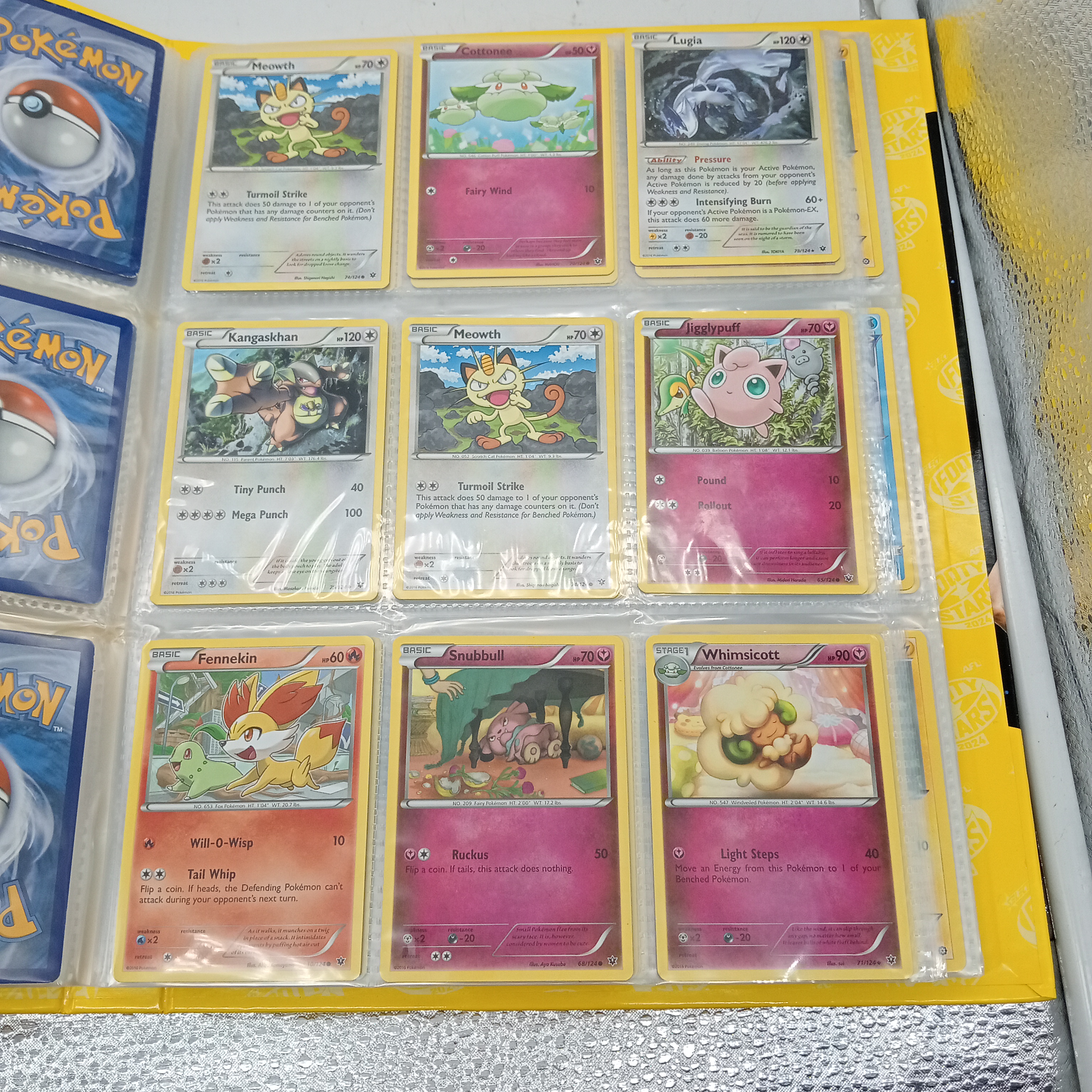 Estimated 170 Assorted Pokemon Cards In AFL Album Includes: Holo, Reverse Holo, Common, Trainer Cards (WR 1343495)