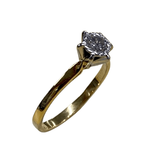Ladies 18ct Yellow & White Gold Single Stone Diamond Ring. Round Brilliant Cut Diamond Illusion Grain Set With Tapered Gallery With Pointed Swept Up Shoulders. TDW 0.20ct. Size L/6, With Valuation Certificate (NG 142944)