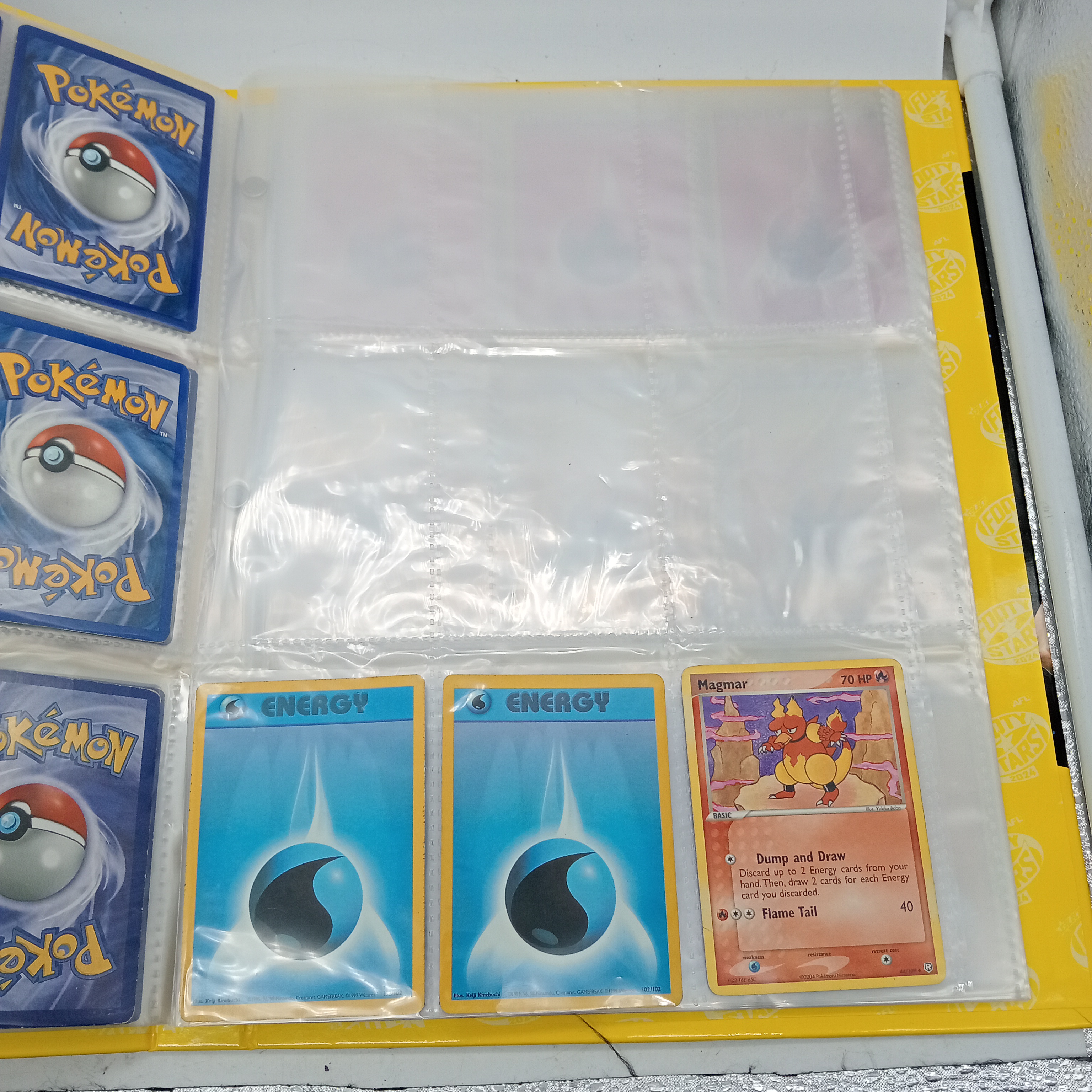 Estimated 125 Assorted Pokemon Cards In AFL Album Includes:  Common & Energy Cards (WR 1343495)