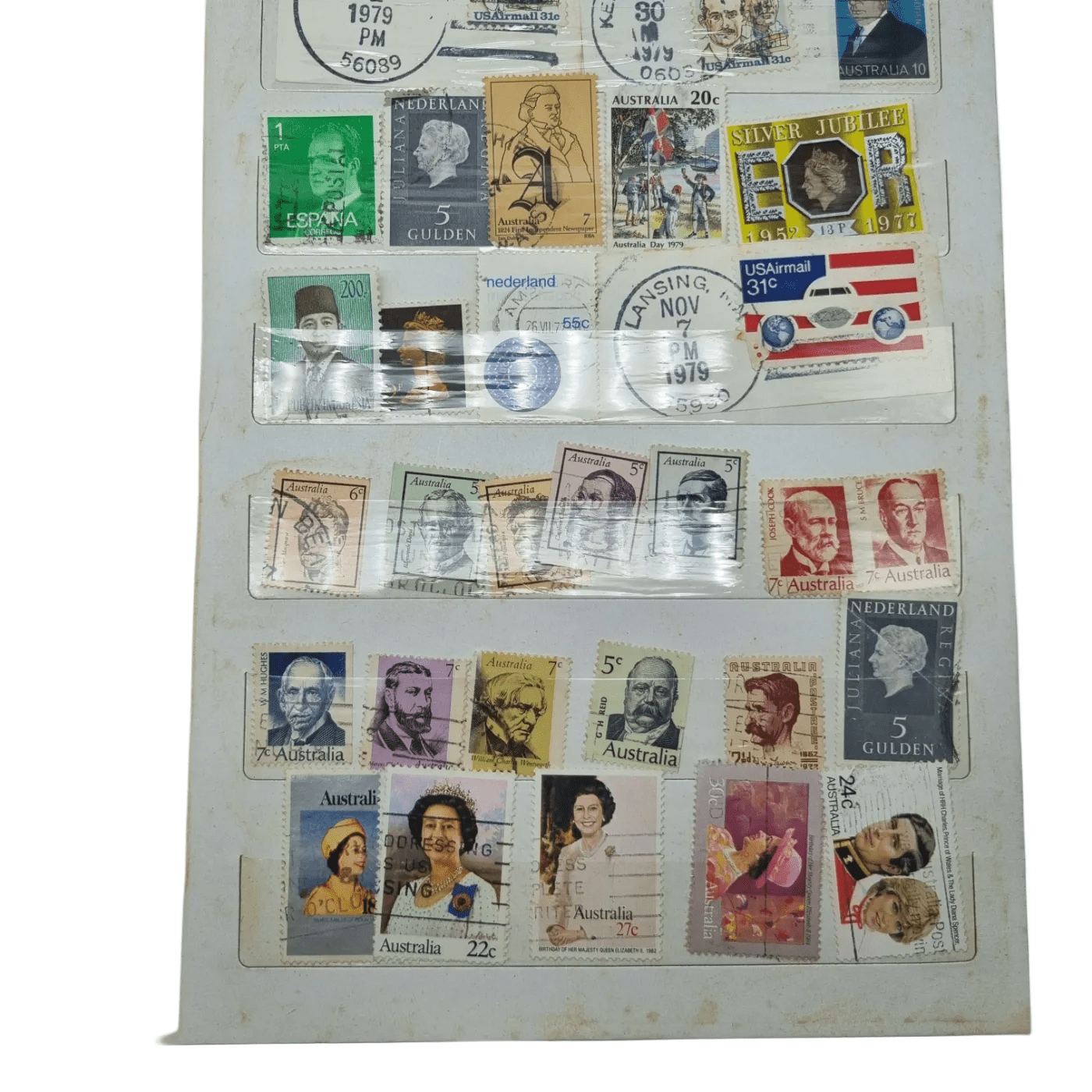 Assorted Global Stamps In Blue Stamp Book (Including: Indonesia, Australia, USA, Nederland)
