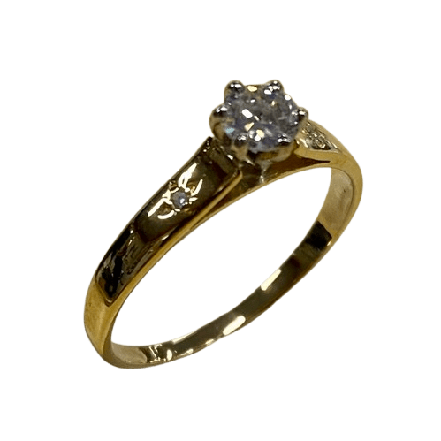 Ladies 18ct Yellow & White Gold 3 Stone Diamond Ring. Round Brilliant Cut 6 Claw Tapered Collet White Gold On A Yellow Gold Under Rail Diamond, With 2 Single Cut Diamonds Star Grain Set In Flat Top Swept Up Shoulders. TDW 0.32ct. Size N/7, With Valuation Certificate (NG 132482)
