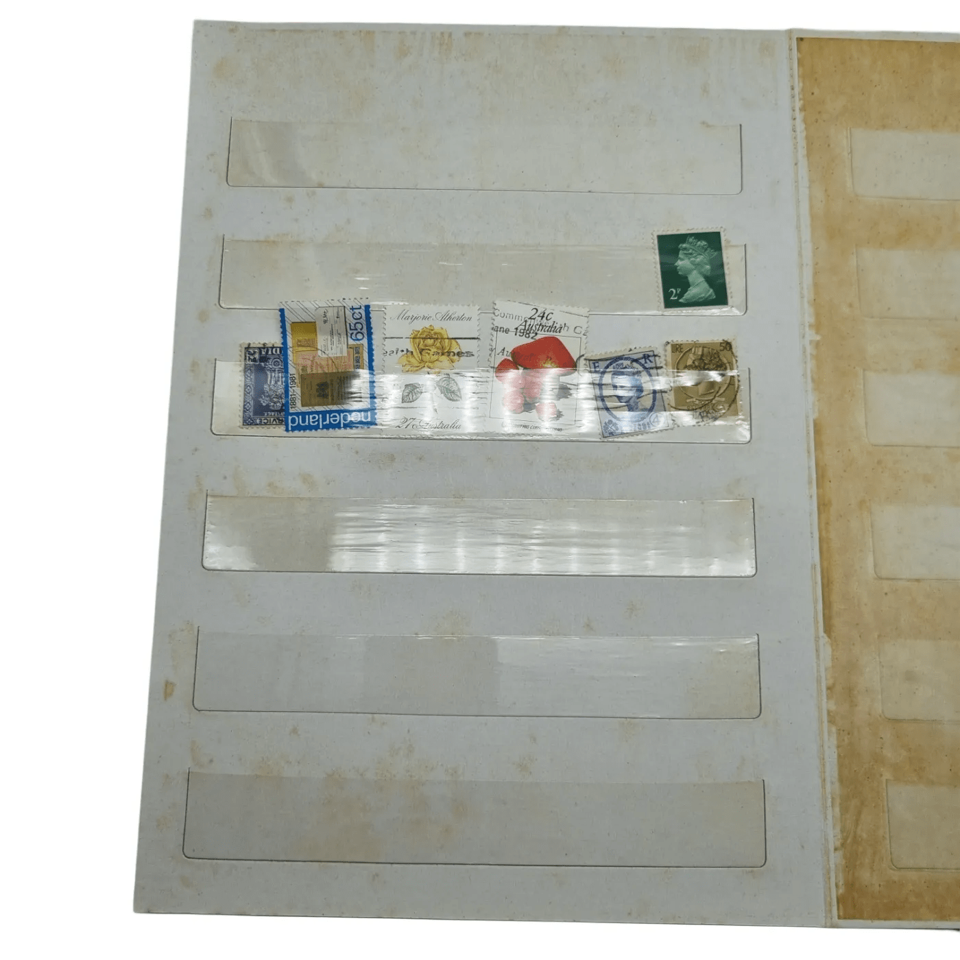 Assorted Global Stamps In Blue Stamp Book (Including: Indonesia, Australia, USA, Nederland)