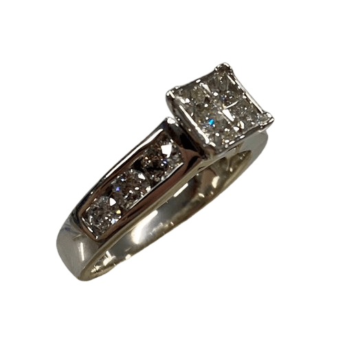 Ladies 14ct White Gold 10 Stone Diamond Ring. 4 Princess Cut Square Invisible Diamonds. With 6 Round Brilliant Cut Diamonds Channel Set Stones Set in Swept Up Shoulders. TDW 1.30ct. Size N/7 . With Valuation Certificate – (NG 143712)