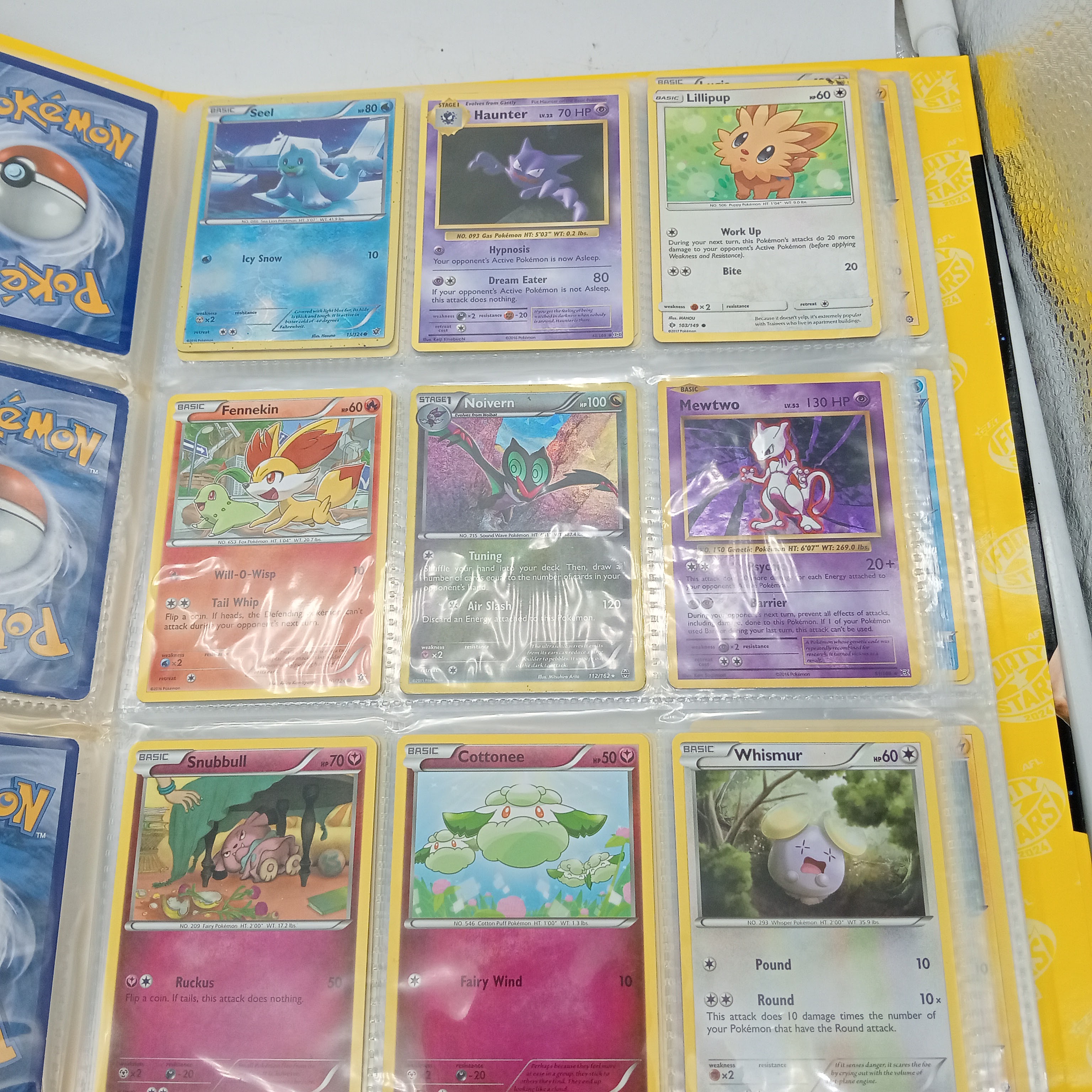 Estimated 170 Assorted Pokemon Cards In AFL Album Includes: Holo, Reverse Holo, Common, Trainer Cards (WR 1343495)