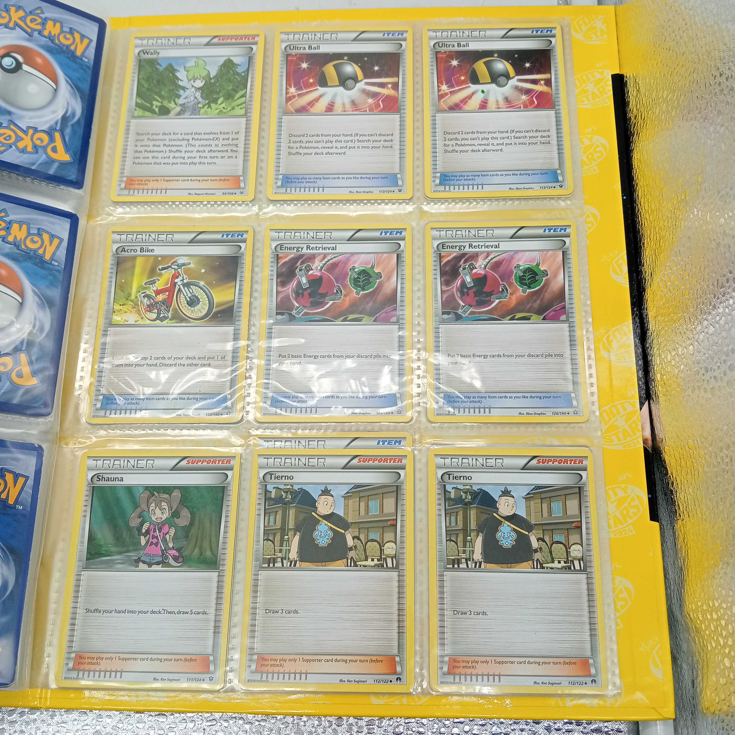 Estimated 170 Assorted Pokemon Cards In AFL Album Includes: Holo, Reverse Holo, Common, Trainer Cards (WR 1343495)