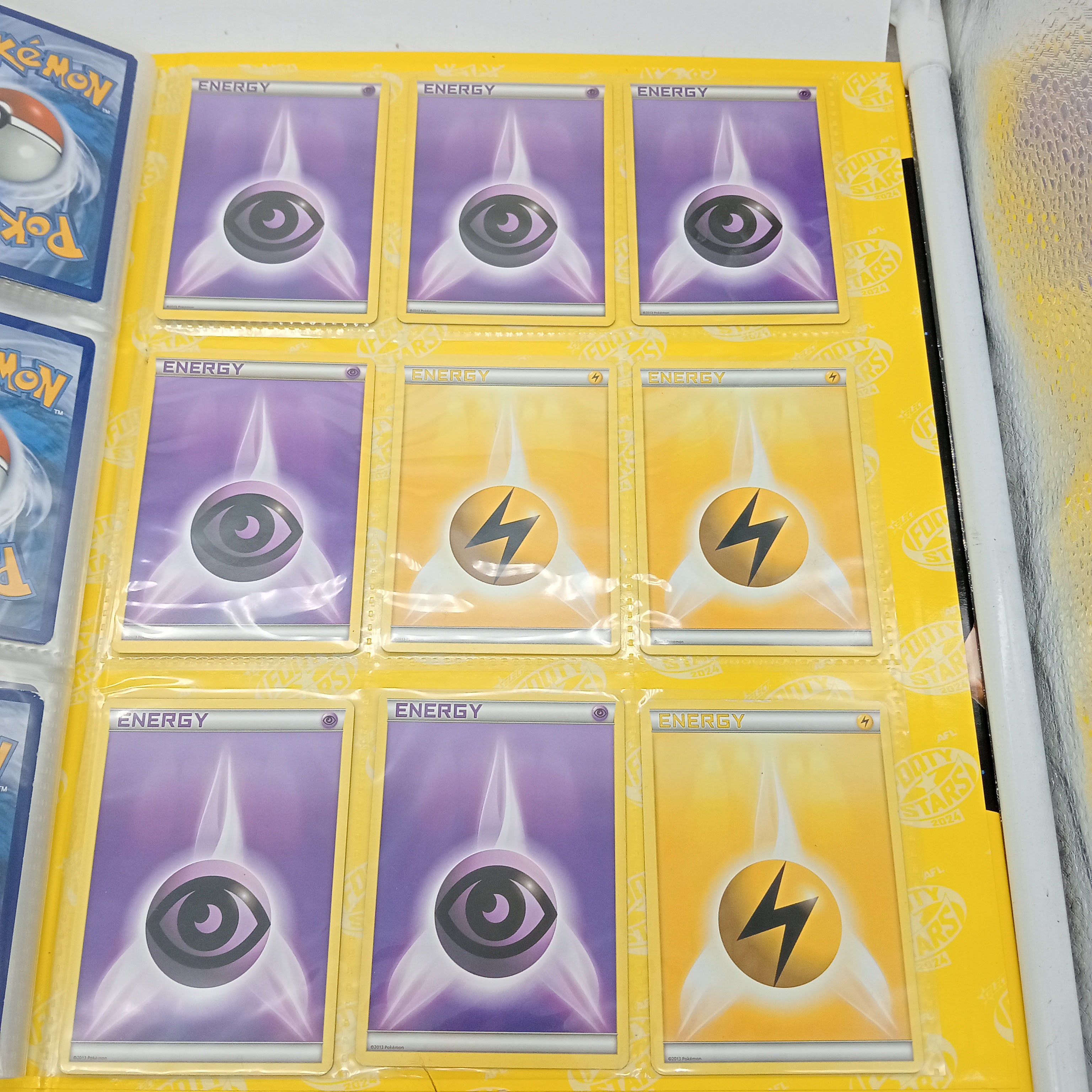 Estimated 125 Assorted Pokemon Cards In AFL Album Includes:  Common & Energy Cards (WR 1343495)
