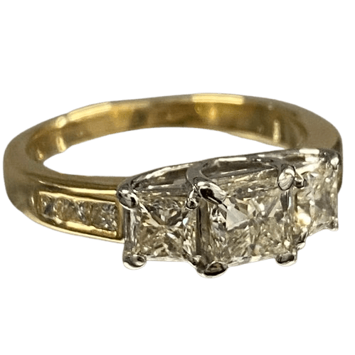 Ladies 18ct Yellow Gold, 3 Princess Cut Claw Set Diamonds with 6 Princess Cut Chanel Set Diamonds. Size M. TDW 1.50ct. With Valuation Certificate