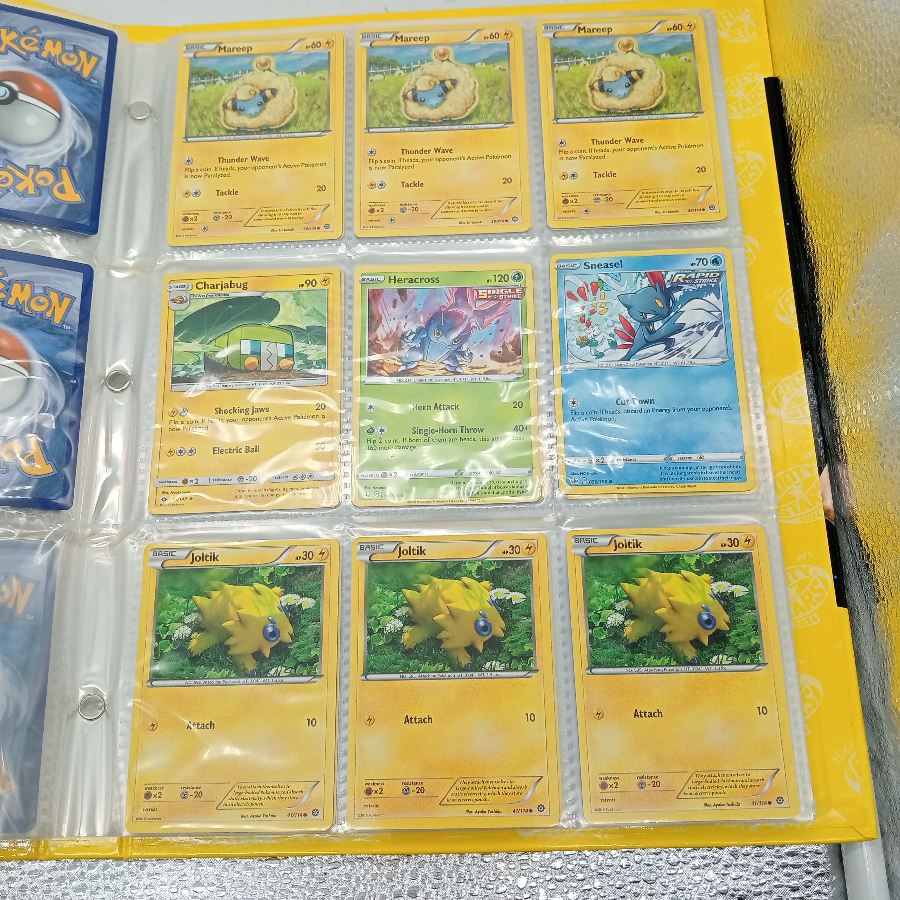 Estimated 170 Assorted Pokemon Cards In AFL Album Includes: Holo, Reverse Holo, Common, Trainer Cards (WR 1343495)