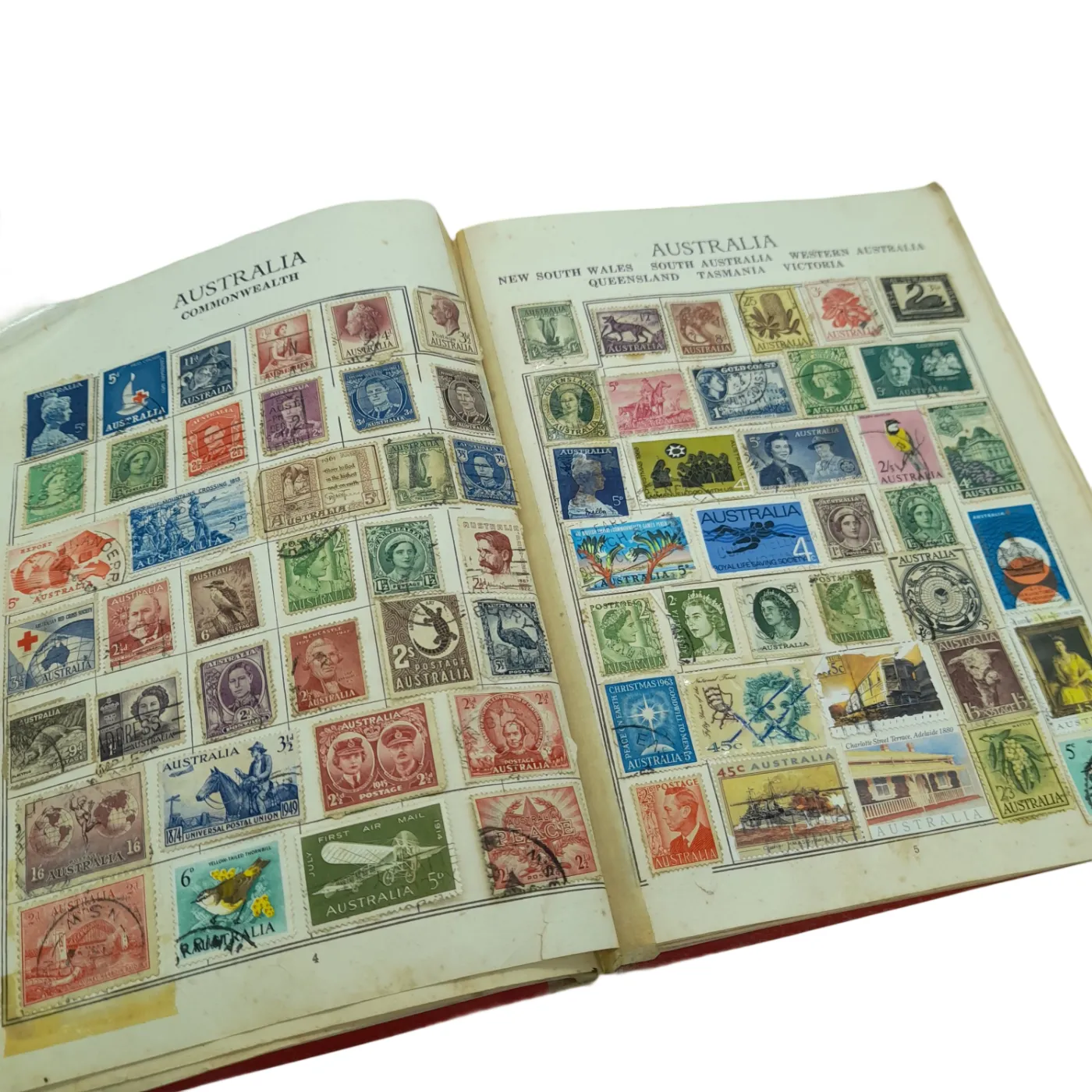 Global Stamp Album Red Book With Stamps From Varying Countries Including: Australia, New Zealand, Bulgaria, Canada, Czech, Denmark, France, UK, Asia, Hungary, Ireland etc (WR 1350167)