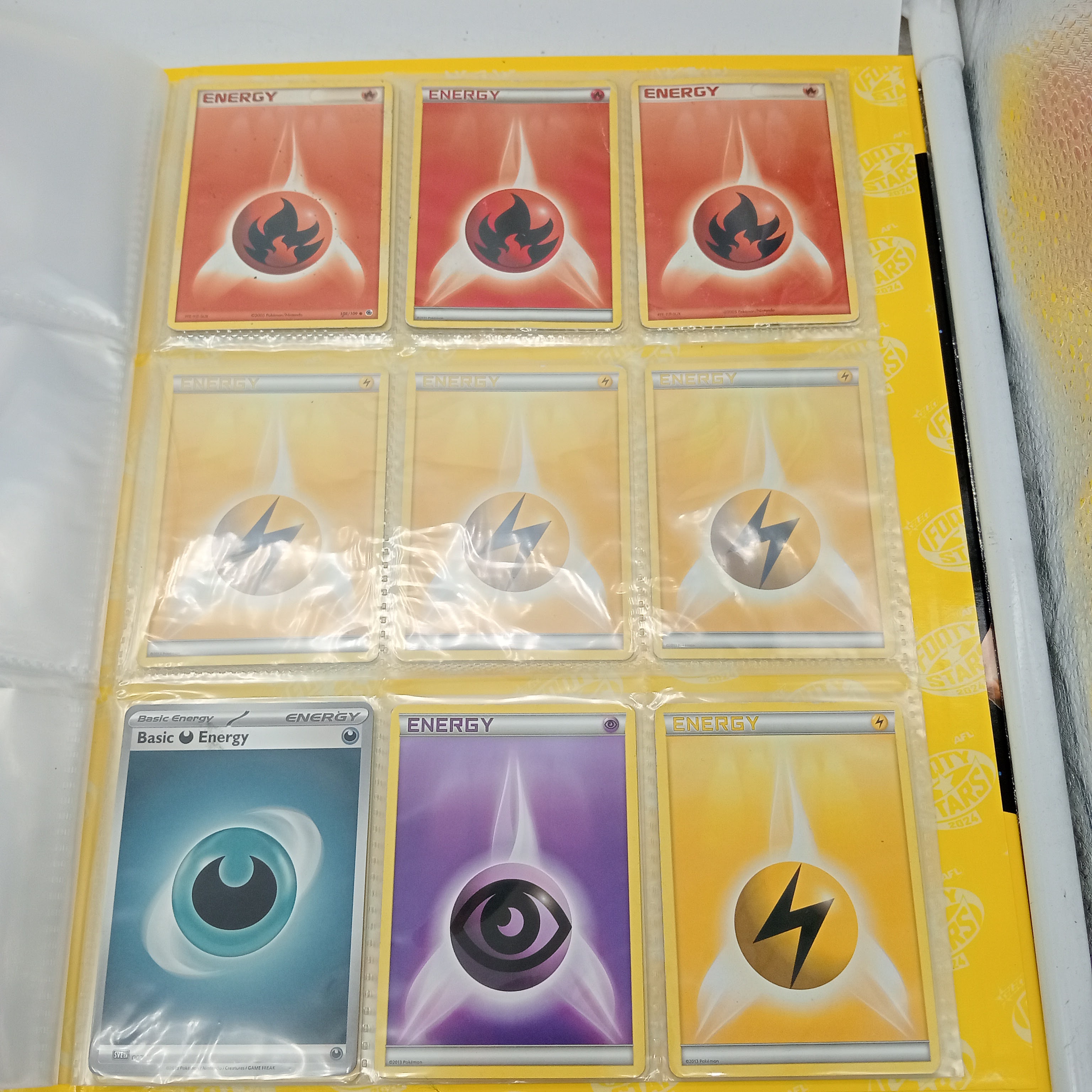 Estimated 125 Assorted Pokemon Cards In AFL Album Includes:  Common & Energy Cards (WR 1343495)