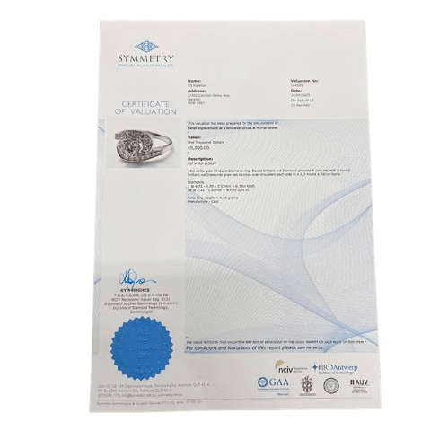 Ladies 14ct White Gold 19 Diamond Ring. Round Brilliant Cut 4 Claw Set 0.35ct Diamond. With 18 Round Brilliant Cut Diamonds Grain Set Stones Set in Cross Over Shoulders. TDW 0.78ct. Size L/6 . With Valuation Certificate – (NG 145637)