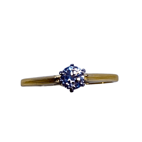 Ladies 18ct Yellow & White Gold Single Stone Diamond Ring. Round Brilliant Cut Diamond White Gold 6 Claw Set With Tapered Pierced Out Collet On Flat Yellow Gold Under Rail With Grooved Swept Up Shoulders. TDW 0.55ct. Size H/4.5, With Valuation Certificate (NG 63624)