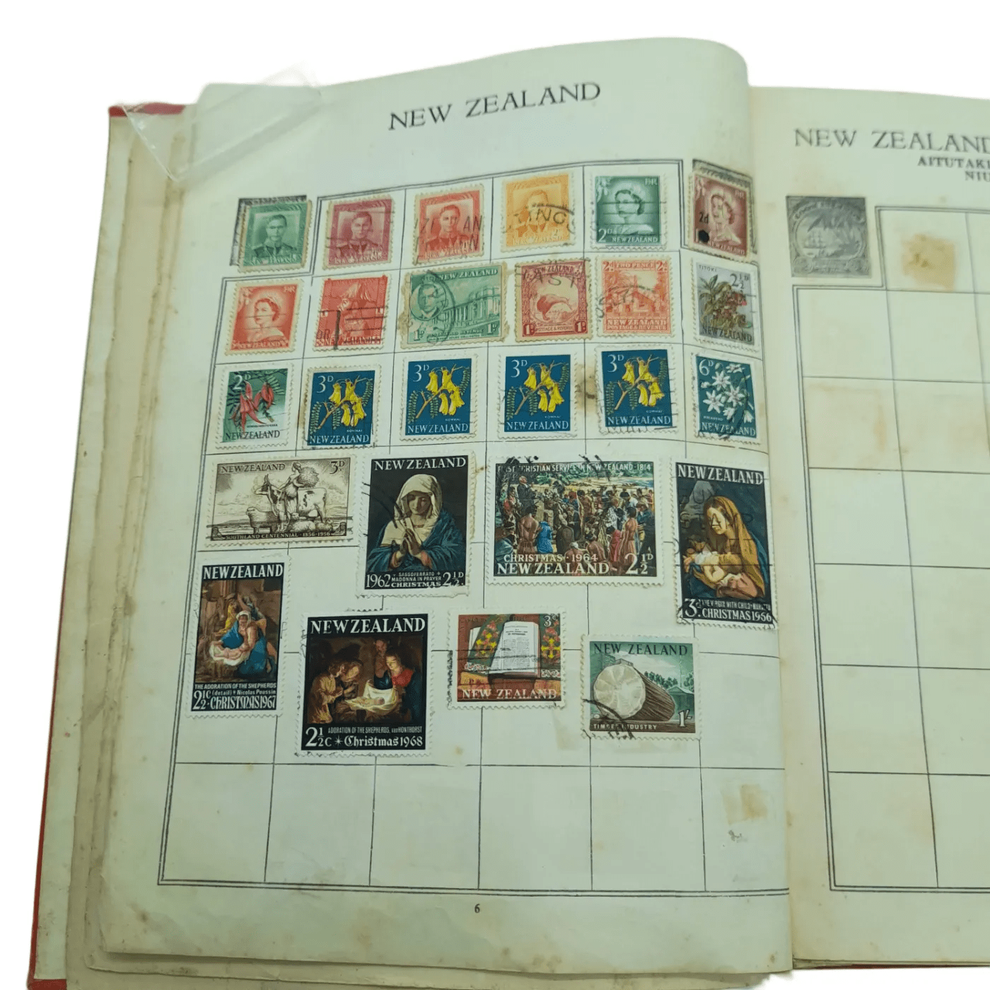Global Stamp Album Red Book With Stamps From Varying Countries Including: Australia, New Zealand, Bulgaria, Canada, Czech, Denmark, France, UK, Asia, Hungary, Ireland etc (WR 1350167)