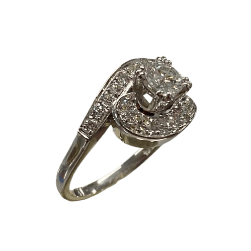Ladies 14ct White Gold 19 Diamond Ring. Round Brilliant Cut 4 Claw Set 0.35ct Diamond. With 18 Round Brilliant Cut Diamonds Grain Set Stones Set in Cross Over Shoulders. TDW 0.78ct. Size L/6 . With Valuation Certificate – (NG 145637)