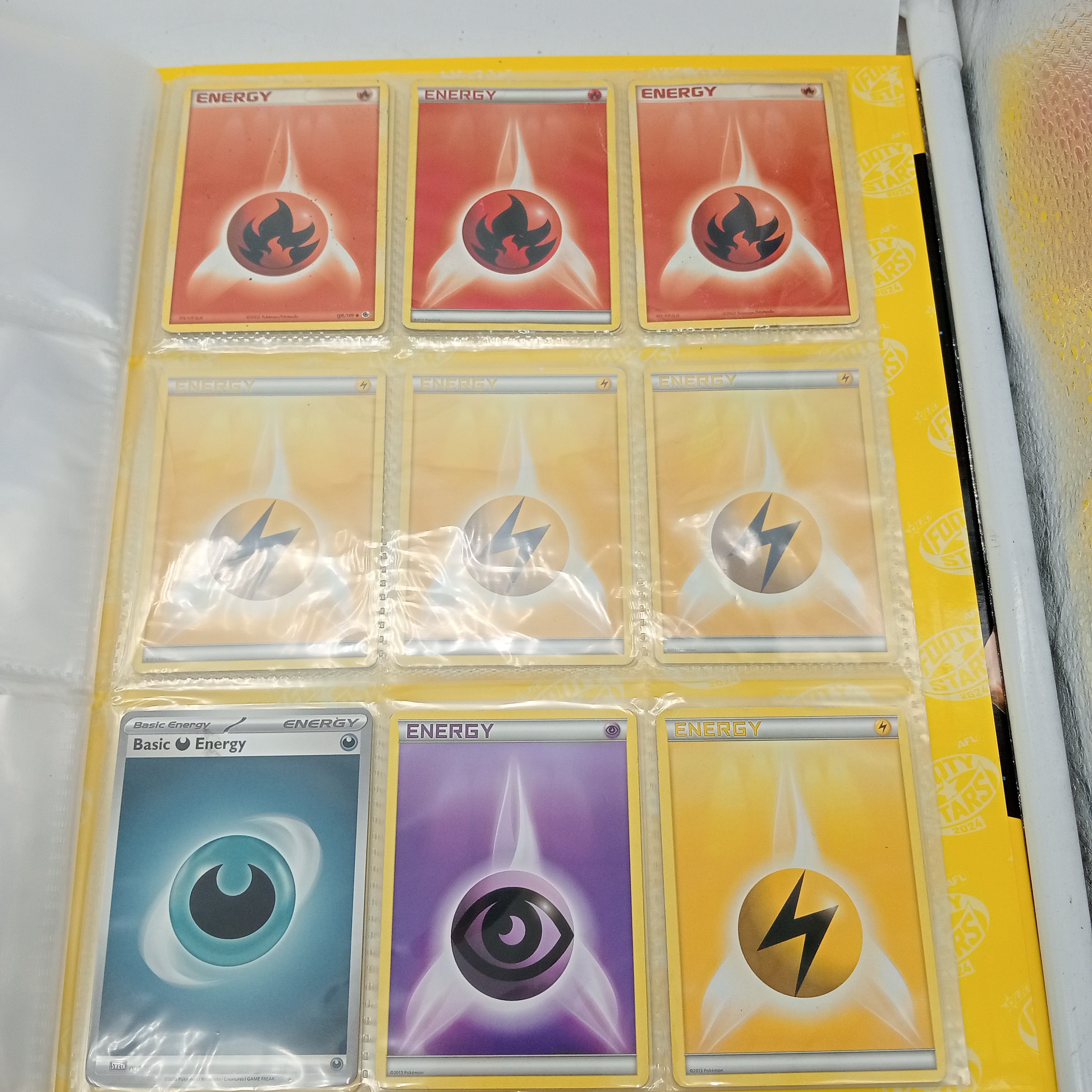 Estimated 125 Assorted Pokemon Cards In AFL Album Includes:  Common & Energy Cards (WR 1343495)