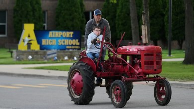 Michigan seniors arrive at school in style on Tractor Day Michigan seniors arrive at school in style on Tractor Day