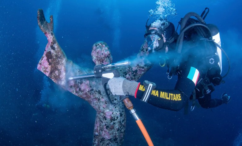 Italian divers water-blast the popular underwater statue of Christ off Portofino Italian divers water-blast the popular underwater statue of Christ off Portofino
