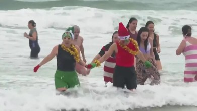 Portuguese swimmers celebrate new year with plunge into the Atlantic Ocean Portuguese swimmers celebrate new year with plunge into the Atlantic Ocean