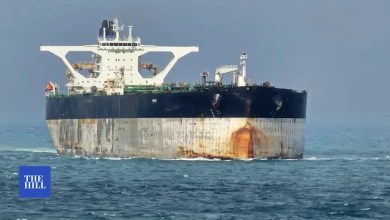 Crew on board oil tanker being pursued by U.S. paints Russian flag on ship Crew on board oil tanker being pursued by U.S. paints Russian flag on ship