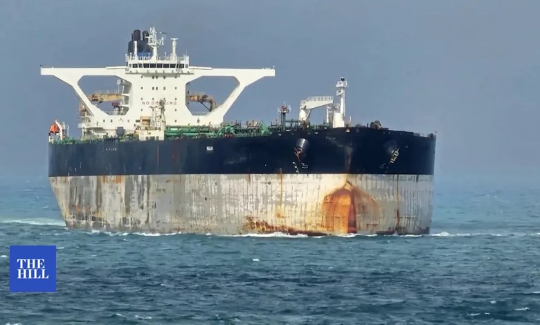 Crew on board oil tanker being pursued by U.S. paints Russian flag on ship Crew on board oil tanker being pursued by U.S. paints Russian flag on ship