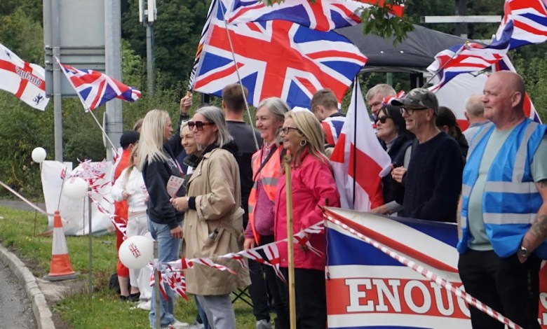 Crowds gather outside hotel housing Afghans with ‘ban foreign criminals’ sign Crowds gather outside hotel housing Afghans with ‘ban foreign criminals’ sign