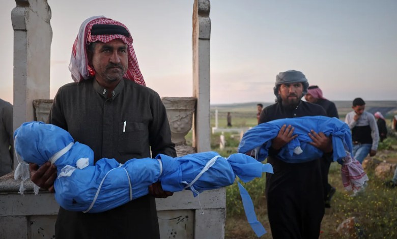 A grieving father buries his 6-year-old after a land mine kills 3 children in Syria’s Idlib A grieving father buries his 6-year-old after a land mine kills 3 children in Syria’s Idlib